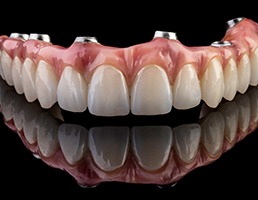  implant dentures with a black background